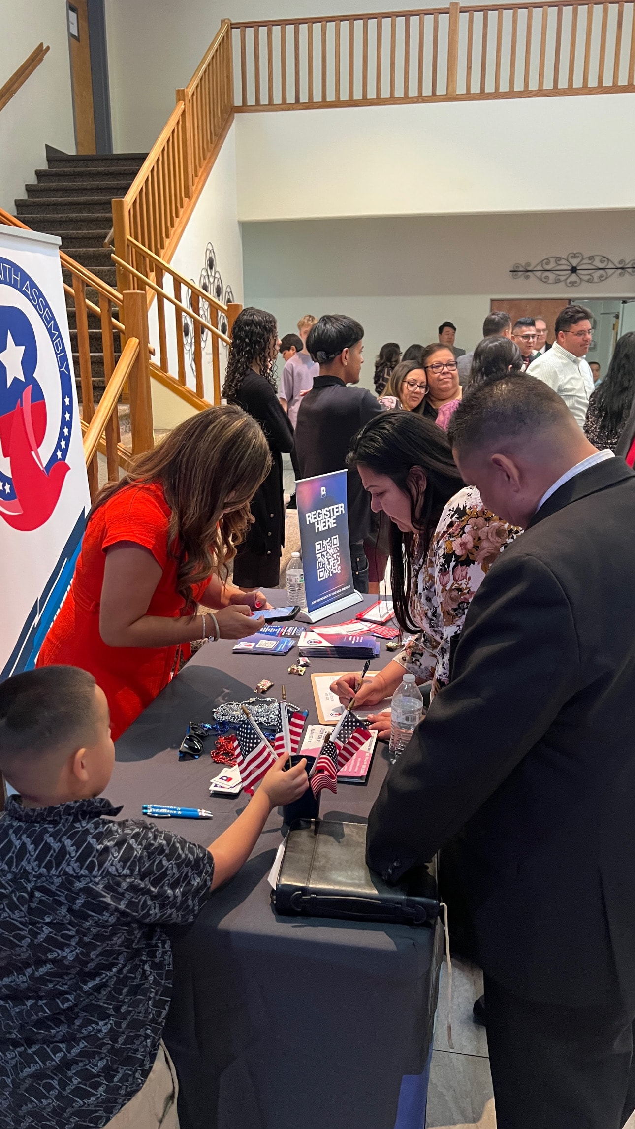 Community registration gathering with American flags